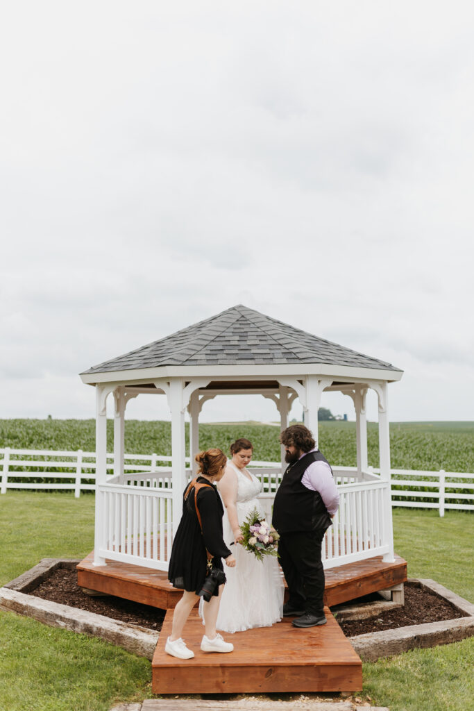 wedding photographer with bride and groom