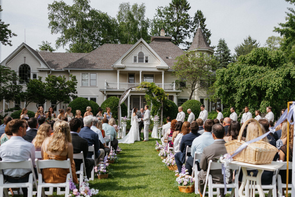 Outdoor wedding ceremony at Halverson House in Waterford, Wisconsin with over 200 guests, photographed by Alex McCrary Photography.